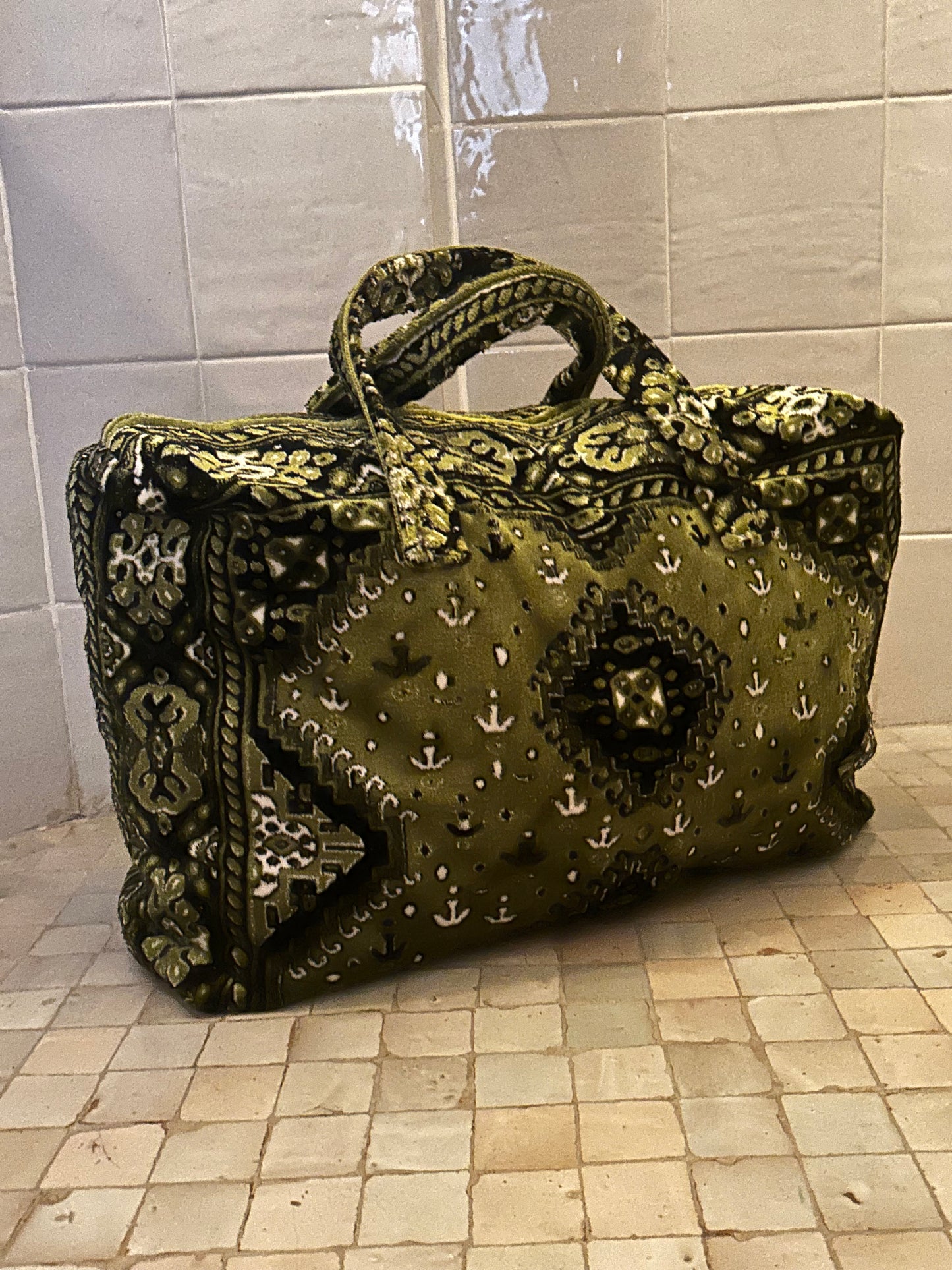 Weekend bag made of carpet fabric in olive green color with white