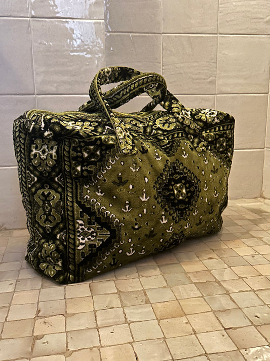 Weekend bag made of carpet fabric in olive green color with white