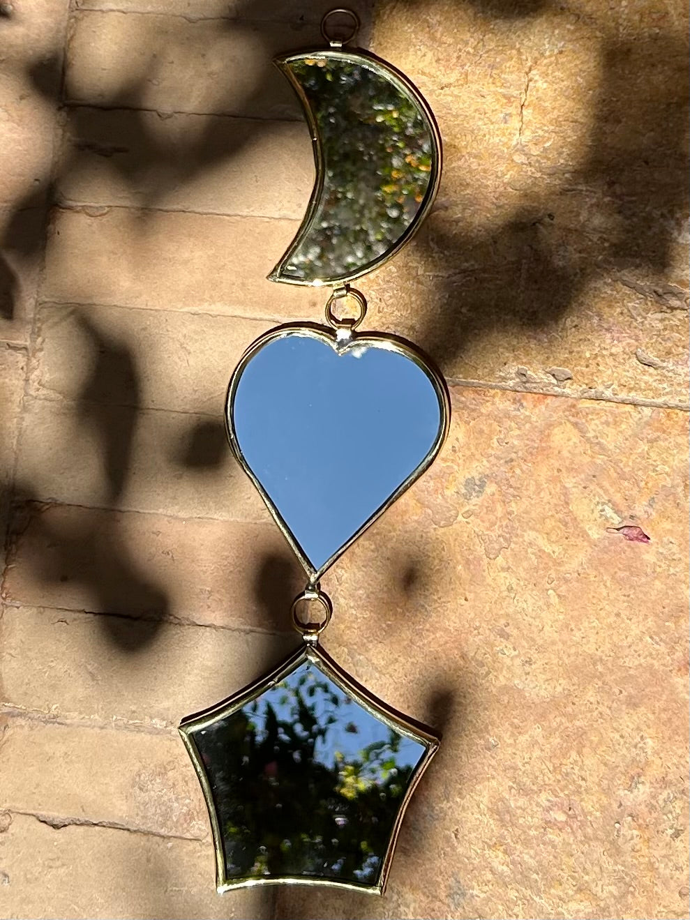 Garland of handmade brass mirrors, moon, heart, star