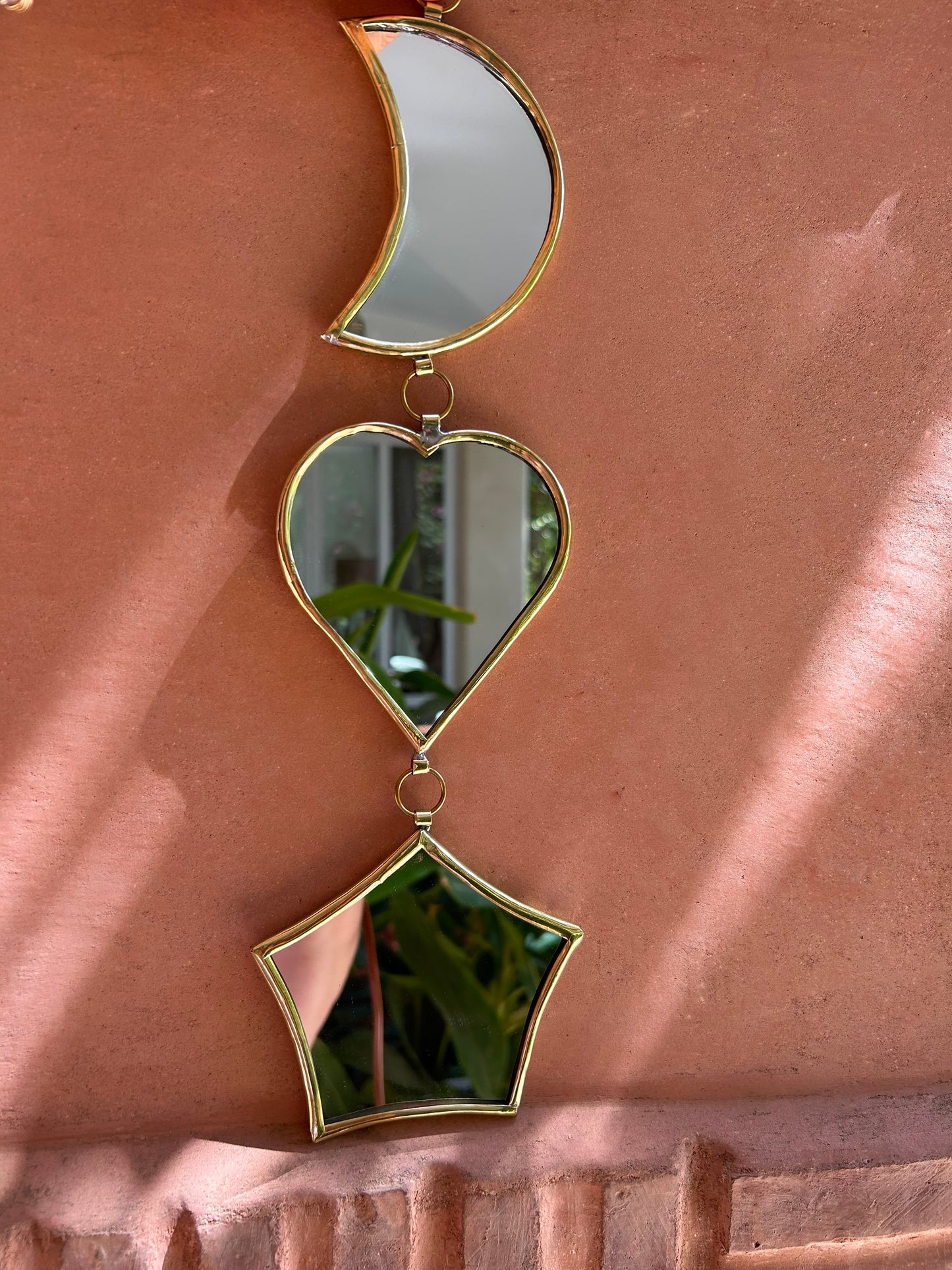 Garland of handmade brass mirrors, moon, heart, star