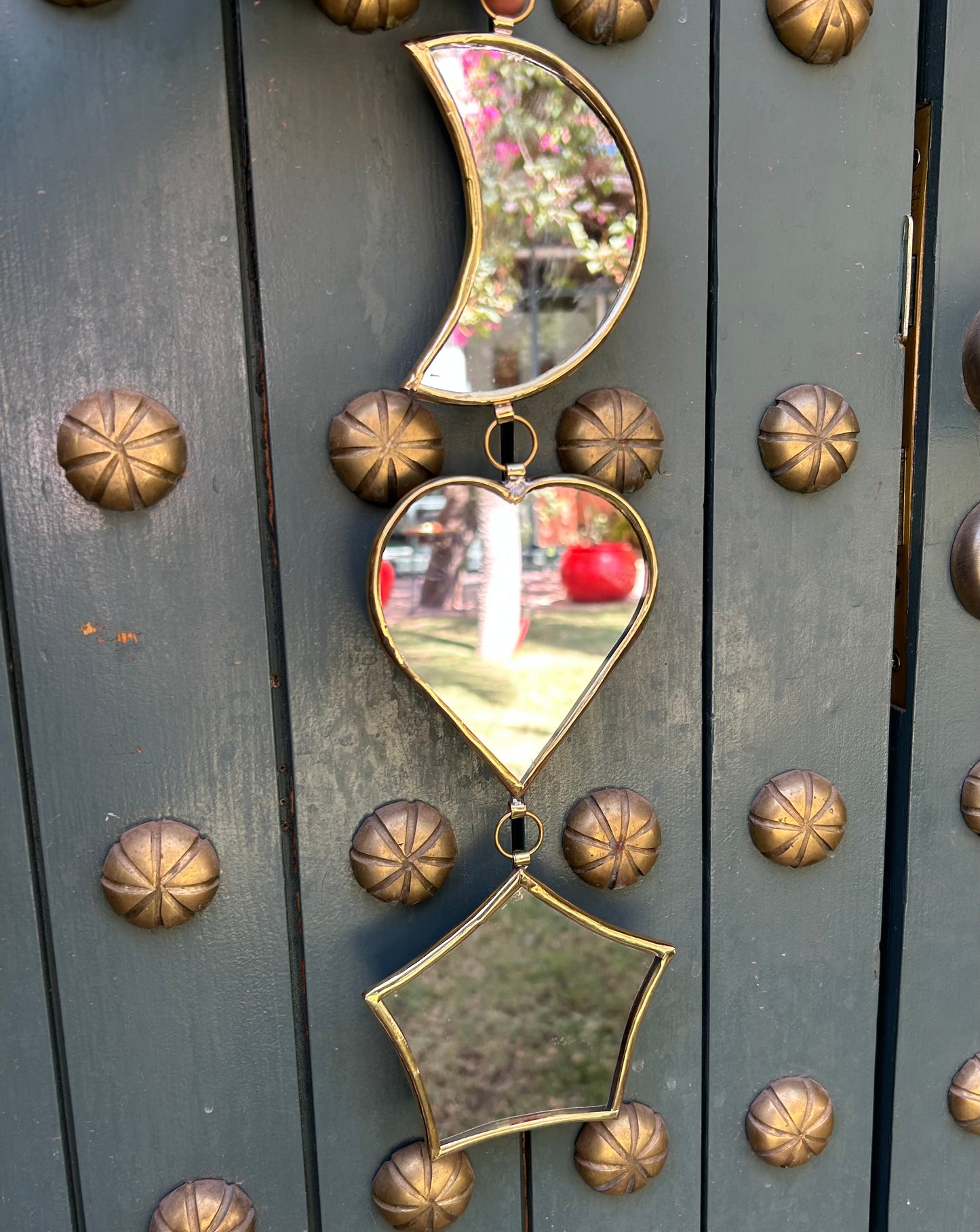Garland of handmade brass mirrors, moon, heart, star
