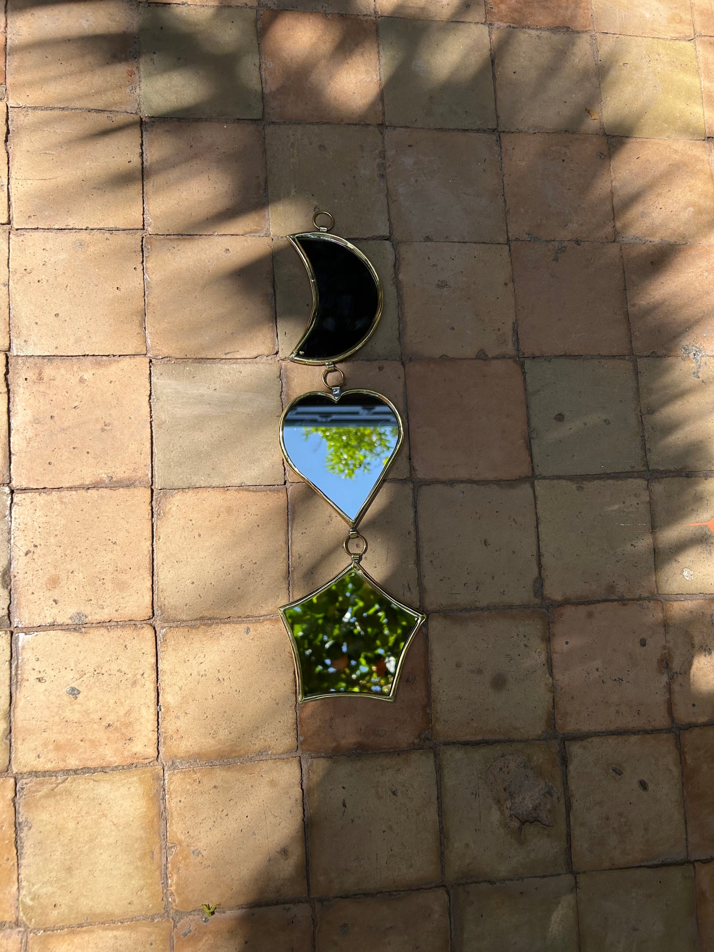 Garland of handmade brass mirrors, moon, heart, star