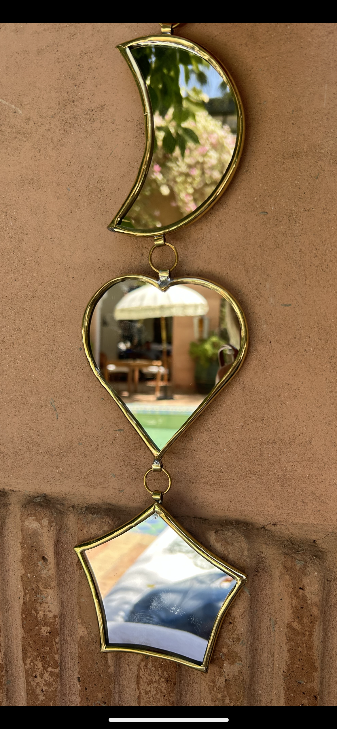 Garland of handmade brass mirrors, moon, heart, star