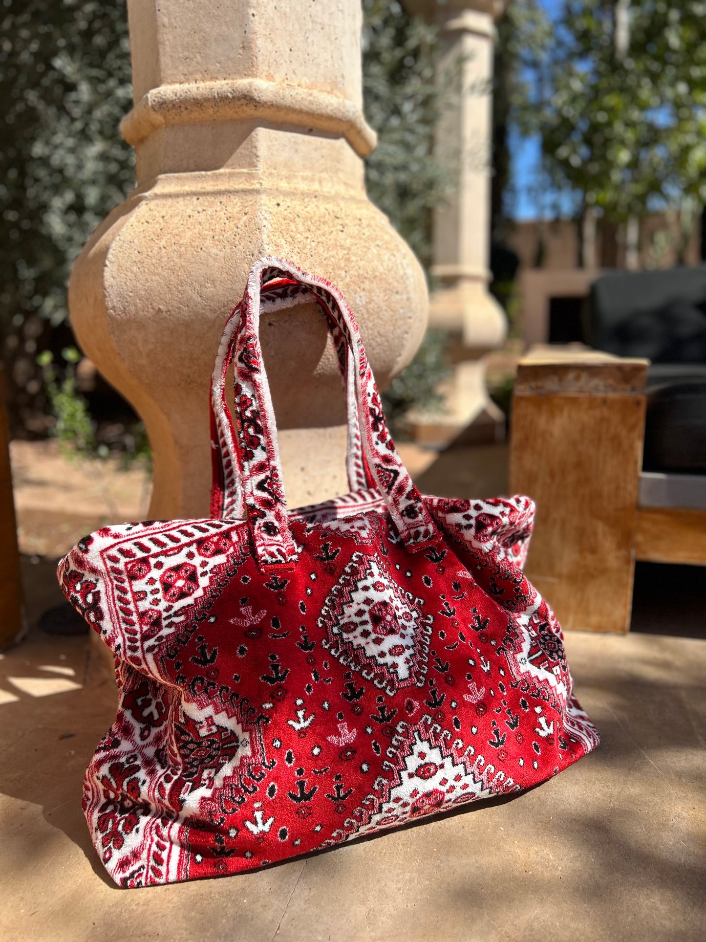 Weekend bag made of red and white carpet fabric