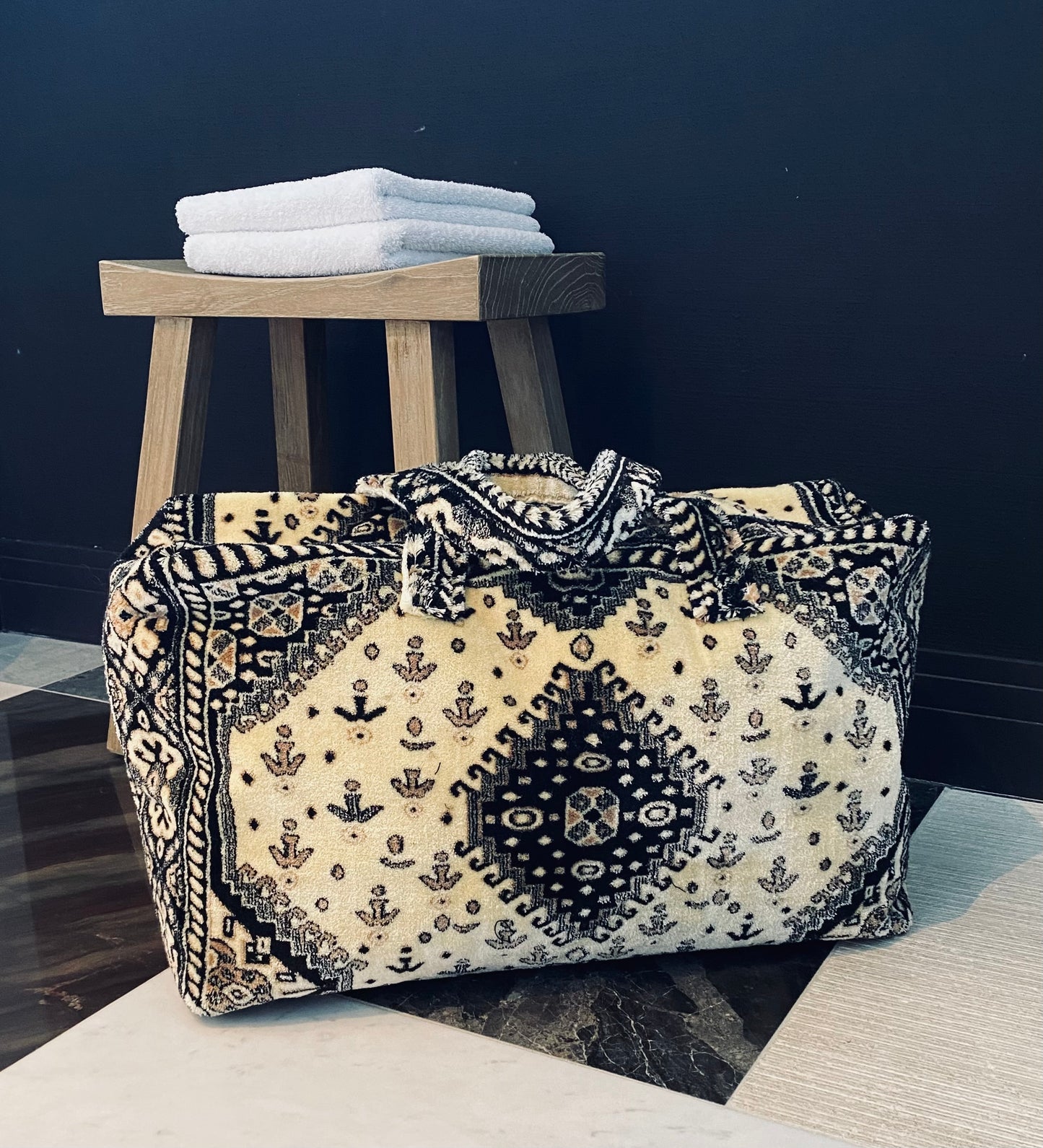 Weekend bag made of black and beige carpet fabric